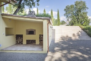 Pizza oven and steps leading to pool