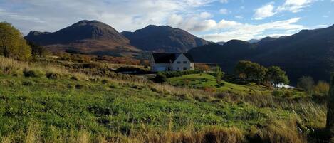 House in summer from the hill side