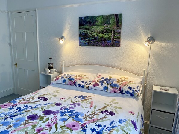 Light and airy bedroom with comfy King size bed, plenty of storage and TV