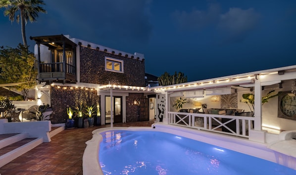 Main villa, alfresco “Palm” lounge, and floodlit pool, with dinning area terrace
