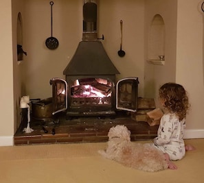 The sitting room features an Inglenook fireplace with wood burner.