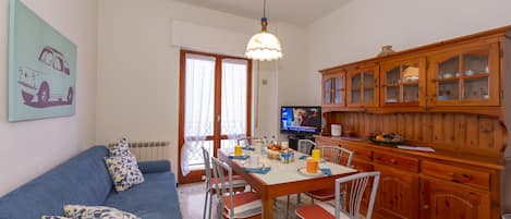 Living room with sofa anddining table