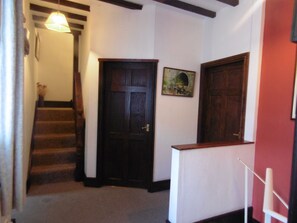 Landing to Tower bedroom, Twin bedroom, lounge and shower toilet & to downstairs