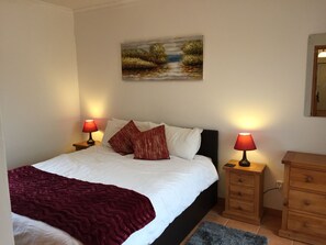 Downstairs bedroom, King size bed with patio doors opening to terrace