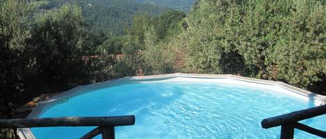 The swimming pool and hills beyond