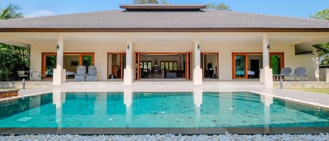 Baan Sawan villa bedrooms, living and dining rooms open on to the veranda & pool