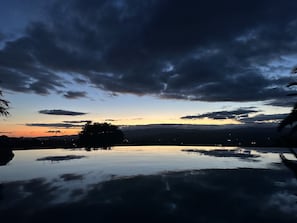 Enjoy serenity at its best, view from Jacuzzi overlooking pool after sunset