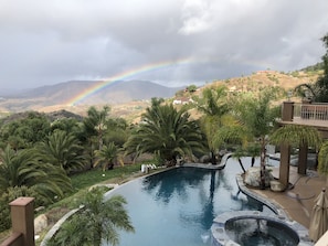 Tranquil and private salt water pool framed by a Fallbrook Rainbow