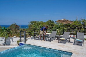 Pool deck with sun loungers