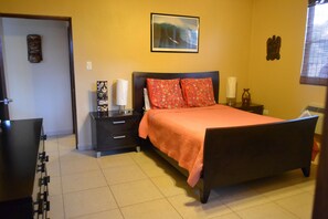 Master bedroom with private bathroom, ceiling fan and AC