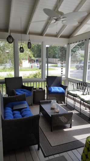 Screened-in front porch is the perfect place for enjoying your morning coffee.