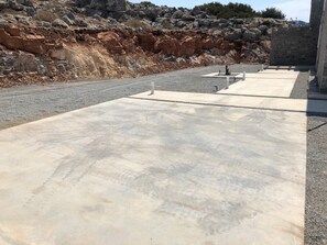 Parking spot and walkway to the front door. 