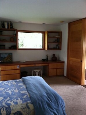custom cabinetry and sliding louvre doors between bedroom and living room 