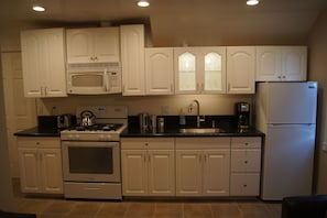 Fully Equipped Kitchen with Everything Needed to Prepare your Favorite Dishes. 