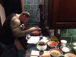 Another master chef hard at work in the well equipped kitchen.