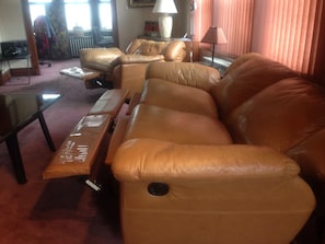 Leather lazy boys open almost flat. Great sleeping for 3 extra guests.
