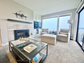 Living room views are terrific from the sofa and chairs by the window. 