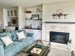 Cozy up to the electric fireplace at any time of day. On & off with a button.