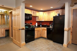 Prepare delicious meals in the wood-furnished kitchen