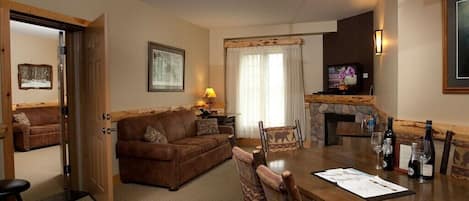 Relax in the beautiful open living room with your group and warm up in front of the fireplace