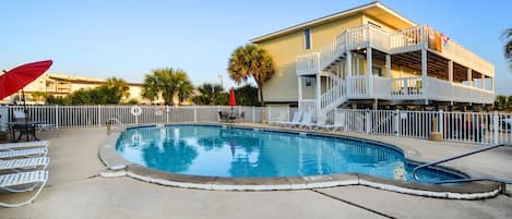 Outdoor Communal Pool - An outdoor pool is featured on site and offers seating for enjoying time in the sun.