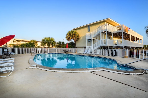 Outdoor Communal Pool - An outdoor pool is featured on site and offers seating for enjoying time in the sun.