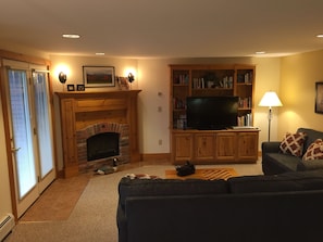 Brick hearth gas fireplace, 49" flat screen TV and lots of family games & movies