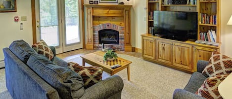 Cozy living area looks out on the woods and Granny Jay ski trail