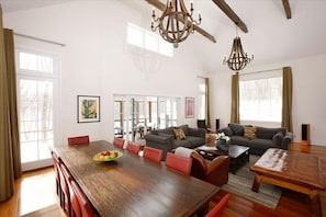 Living room and dining room, looking out to pool