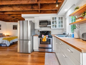 Cook up a delicious meal in the sunny, fully equipped kitchen.