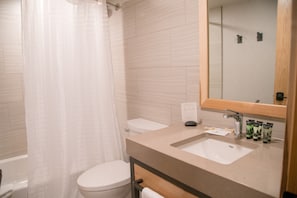 Get ready for the day ahead in the full and bright bathroom.