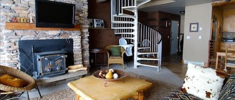 Living Room with fireplace and wall mounted flat screen tv