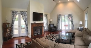 Great room with gas fireplace, 55" smart tv, blue ray, Apple TV, and Wii.