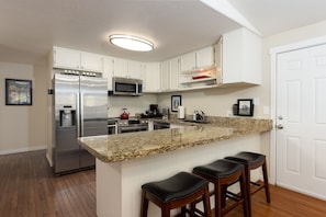 Newly remodeled kitchen with all cookware and bake ware