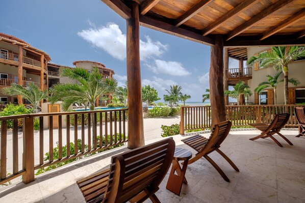Indigo Belize 2A veranda with porch access to pool and beach