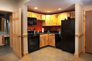 Cook gourmet meals in the fully equipped, wood furnished kitchen