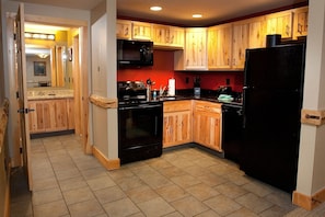 Prepare delicious homemade meals in the beautiful wood-furnished kitchen