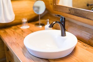 Main bathroom with sink/vanity, walk-in large tile shower and toilet. 