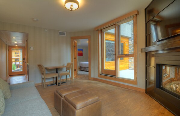 The spacious living room opens onto a balcony.