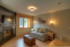 Relax on the comfortable sofa by the gas fireplace after an adventurous day.
