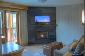 Watch a great movie on the flat panel TV while warming up in front of the fireplace.