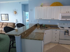 Full kitchen which includes full size appliance and granite counter tops. 