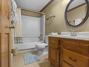 Enlarged bathroom with shower and tub