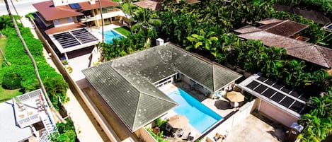 Areal view of Home with gate at Garden side to beach between homes