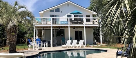 906 Carolina Blvd., welcomes visitors to their vacation rental with a private pool and large back yard, just 1 block from the beach!