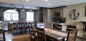 island seating , middle dining table. Large gathering space