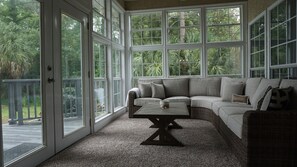 Bright comfy Sunroom. Perfect morning coffee spot. 