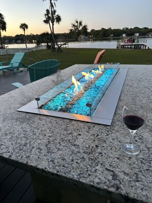 Enjoy beautiful evenings on the Bayou with a natural gas fire table.