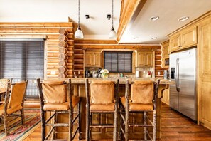 Open floor plan with dining room and bar seating