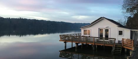 Our eco-cottage in high tide stillness over the Salish Sea.